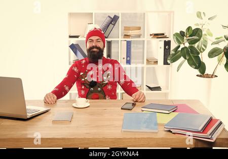 Keeping festive. Happy businessman in Christmas jumper. Fashion hipster in office. Fashion knitwear for winter holidays. Fashion trends for holiday Stock Photo