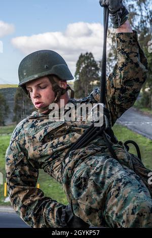 U.S. Marine Pfc. Jack Gaines, a student with Basic Reconnaissance Course 2-20, Reconnaissance Training Company, Advanced Infantry Training Battalion, School of Infantry - West, applies his brake during helicopter rope suspension techniques training at the 13 Area rappel tower on Marine Corps Base Camp Pendleton, California, Jan. 22, 2020.  HRST training includes classes and practical application of fast-roping, rappelling, belaying and special patrol insertion/extraction rigging from various aircraft. Gaines is a native of Omaha, Nebraska. (U.S. Marine Corps photo by Lance Cpl. Alison Dostie) Stock Photo