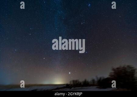 This is a portrait of the winter sky rising in the southeast on January 9, 2021, taken from home in Alberta.  The constellation of Orion is at centre Stock Photo