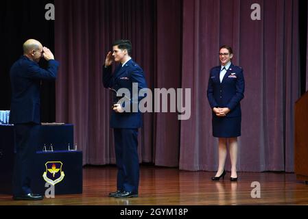 U.S. Air Force Gen. Mike Holmes, the commander of Air Combat Command, salutes 2nd Lt. Benjamin Gautier for earning the Air Education and Training Command Commander’s Trophy Jan. 24, 2020, on Columbus Air Force Base, Mississippi. The Air Education and Training Command Commander’s Trophy is awarded to student pilots for being the most outstanding students overall in their classes. (U.S. Air Force photo by Airman 1st Class Jake Jacobsen) Stock Photo