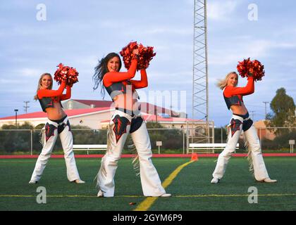 200128-N-KH151-0203 NAVAL STATION ROTA, Spain (Jan. 28, 2020) Denver Broncos cheerleaders perform a half-time show during an exhibition flag football game between Sailors and Marines at Naval Station (NAVSTA) Rota. Naval Station Rota sustains the fleet, enables the fighter and supports the family by conducting air operations, port operations, ensuring security and safety, assuring quality of life and providing the core services of power, water, fuel and information technology. (U.S. Navy photo by Mass Communication Specialist 2nd Class Eduardo Otero) Stock Photo