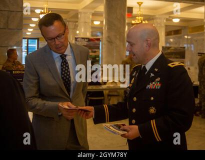 Col. Joel Grant, Chief of Staff, 807th MC(DS), listens to Spc. Joanna ...