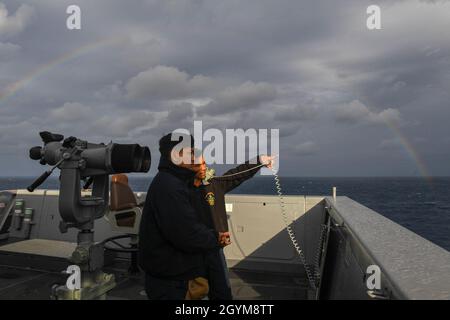 PHILIPPINE SEA (Jan. 28, 2020) Boatswain's Mate Seaman Apprentice Ronne Racela from Oceanside, California, receives watch instruction from Seaman Sandor Vega from Mission ,Texas, on the bridge wings of amphibious transport dock ship USS Green Bay (LPD 20). Green Bay, part of the America Expeditionary Strike Group, 31st Marine Expeditionary Unit team, is operating in the U.S. 7th Fleet area of operations to enhance interoperability with allies and partners and serve as a ready response force to defend peace and stability in the Indo-Pacific region. (U.S. Navy photo by Mass Communication Special Stock Photo