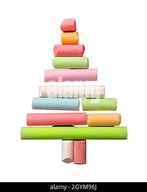 Christmas tree shape with colorful chalk pieces isolated cutout on white. Winter holidays for students, happy children. Xmas and New year greetings ca Stock Photo