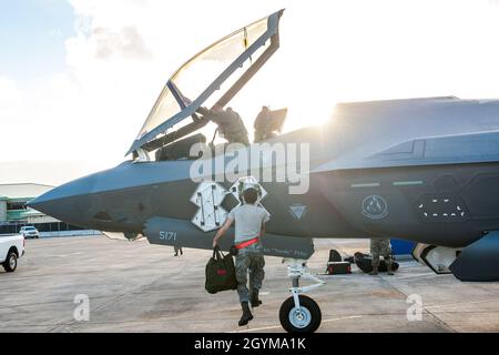 A pilot from the 63rd Fighter Squadron shakes hands with an F-35 ...