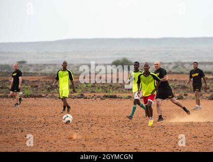 Soldiers from the Djiboutian Army’s Rapid Intervention Battalion (RIB) play a soccer match against service members from Combined Joint Task Force – Horn of Africa (CJTF-HOA) near Djibouti City, Djibouti, Jan. 30, 2020. Events such as the soccer match help strengthen relationships and esprit de corps between the RIB and CJTF-HOA service members. (U.S. Air Force photo by Senior Airman Dylan Murakami)