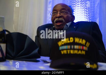 Pvt. Roosevelt Ruffin, a former Army Soldier who served with Company C, 614th Tank Destroyer Battalion, during World War II, interacts with guests at his 100th birthday celebration Feb. 1, 2020, in Virginia Beach, Virginia. Ruffin was one of the very first African-American tank destroyer unit members of the war. (U.S. Army Reserve photo by Sgt. 1st Class Javier Orona) Stock Photo