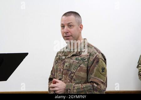 Brig. Gen. Howard Geck, commanding general, 103rd Expeditionary Sustainment Command, bids farewell to the 320th Quartermaster Detachment and welcomes the 618th Quartermaster Detachment during the 320/618th Quartermaster Detachment transfer of authority ceremony at Camp Arifjan, Kuwait, Feb. 2, 2020. (U.S. Army Reserve photo by Spc. Dakota Vanidestine) Stock Photo