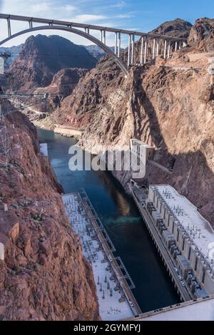 The powerhouse generating station at the base of Hoover Dam with the Mike O’Callaghan-Pat Tillman Memorial Bridge over the Colorado River. Stock Photo