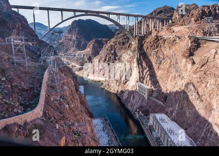 The powerhouse generating station at the base of Hoover Dam with the Mike O’Callaghan-Pat Tillman Memorial Bridge over the Colorado River. Stock Photo