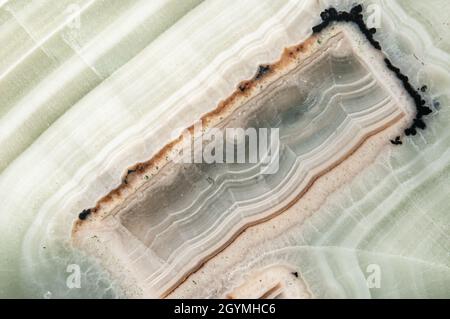 Macro photo of textured polished semi precious stone agate. Abstract background. Stock Photo