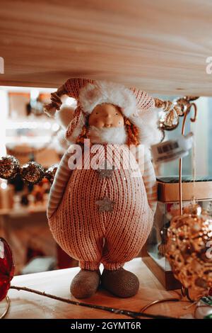 Funny winter Christmas toy on a festive storefront. New Year and Merry Christmas decorations and a magical winter atmosphere. Stock Photo