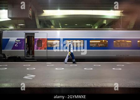 People wearing a protection mask for the Covid-19 in the Paris Montparnasse train station. France. Stock Photo