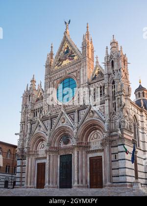 Siena Cathdral or Duomo di Siena West Facade Exterior in Italian Gothic Style in Tuscany, Italy Stock Photo