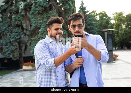 Two students help your classmate with navigation Stock Photo