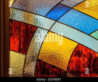 Embossed painted glass with metal separated sections. Geometric shapes with colored glass Stock Photo