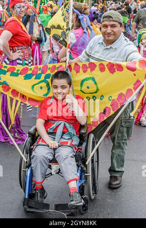Cleveland Ohio,University Circle,Parade the Circle annual event,Hispanic wheelchair disabled handicapped special needs father child boy son Stock Photo
