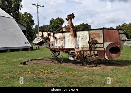 An antique threshing machine. Stock Photo