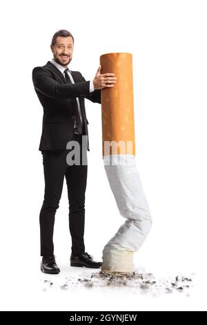 Full length portrait of a businessman putting off a big cigarette isolated on white background Stock Photo