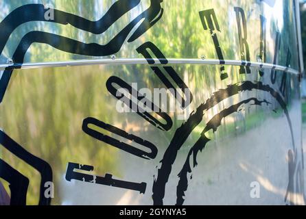 Metal american caravan used as mobile catering vehicle. Letter sticker Stock Photo