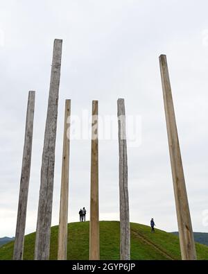 Hessen, Germany. 08th Oct, 2021. 08 October 2021, Hessen, Glauburg: A reconstructed burial mound and a group of enigmatic wooden posts stand in the Celtic World Archaeological Park on the Glauberg. In 1994, a research team had begun excavations and discovered, among other things, the now world-famous statue of the 'Celtic Prince of the Glauberg'. The Celtic settlement in the Wetterau is to become a Unesco World Heritage Site. The federal states have to submit their proposals for the national preselection procedure to the Conference of Ministers of Culture by October 31. (to dpa 'May settlement Stock Photo