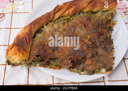 spinach pie, Greek traditional spanakopita, handmade pie baked in an oven Stock Photo