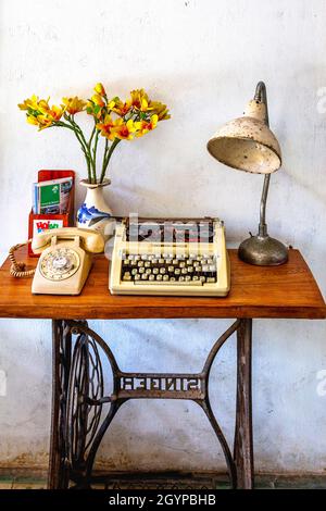 old typewriter on a old table in an Old Town Shop. Stock Photo