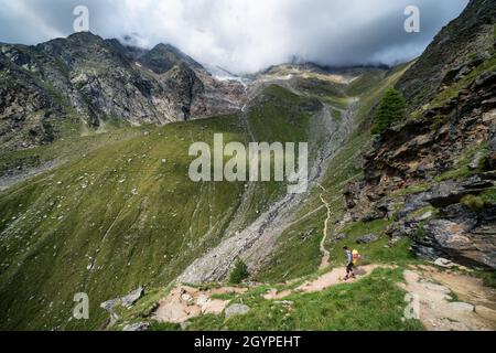 Hiking towards Mischabelhütte Alpine hut near Saas-Fee, Switzerland Stock Photo