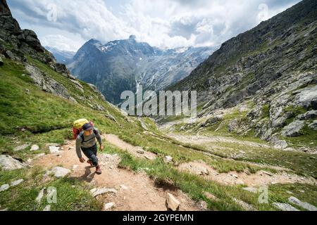 Hiking towards Mischabelhütte Alpine hut near Saas-Fee, Switzerland Stock Photo