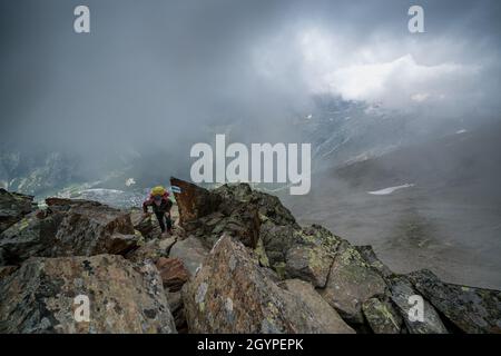 Hiking towards Mischabelhütte Alpine hut near Saas-Fee, Switzerland Stock Photo