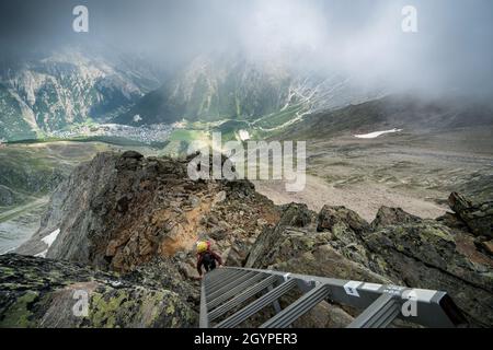 Hiking towards Mischabelhütte Alpine hut near Saas-Fee, Switzerland Stock Photo