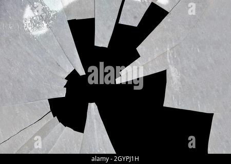 broken glass texture in shattered window on black background Stock Photo