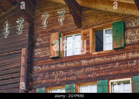 Closeup of Haus Guetsch, a famous old Swiss chalet on the Simmen Valley house trail in Lenk - Simmental, Berner Oberland, Switzerland Stock Photo