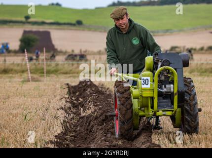 Mindrum Mill, Northumberland, England, UK, 9th October 2021. British Ploughing Championships: the 70th championships, cancelled due to Covid-19 last year, take place. A variety of tractor classes and hand drawn ploughs compete for prizes over the two day event. Pictured: a Trusty horticultural hand plough Stock Photo