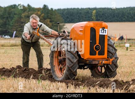 Mindrum Mill, Northumberland, England, UK, 9th October 2021. British Ploughing Championships: the 70th championships, cancelled due to Covid-19 last year, take place. A variety of tractor classes and hand drawn ploughs compete for prizes over the two day event. Pictured: a British Anzani Iron Horse horticultural hand plough Stock Photo