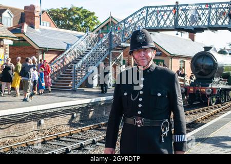 Sheringham, Norfolk, UK - SEPTEMBER 14 2019: Man in 1940s police officer uniform at Sheringham train platform during 1940s weekend Stock Photo