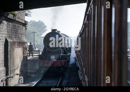 Sheringham, Norfolk, UK - SEPTEMBER 14 2019: WD 2-10-0 – 90775 ‘The Royal Norfolk Regiment’ 1943 steam train at the platform during 1940s weekend Stock Photo