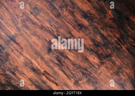 Brown and black grungy painted stucco wall background Stock Photo