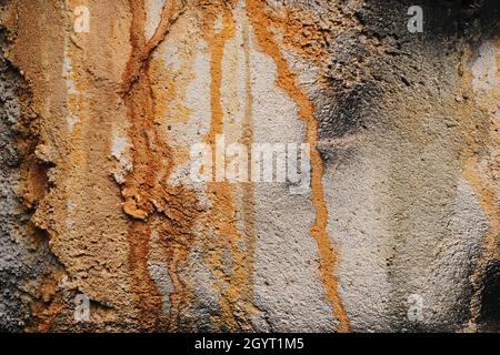 Rust stain on gray cement plaster wall, grunge background or texture Stock Photo