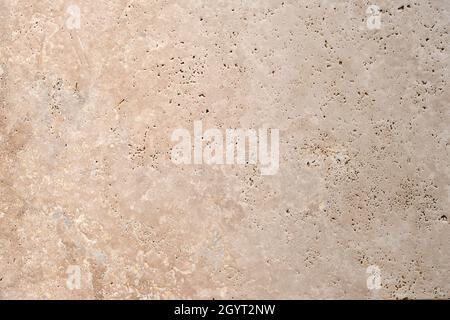 Classic travertine stoneware porcelain tiles, rustic natural stone effect, porous limestone texture detail Stock Photo