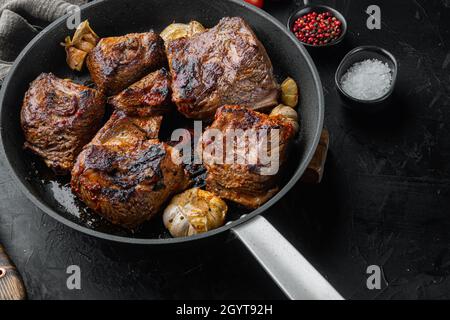 Homemade Braised Beef Short Ribs set, on black stone background Stock Photo