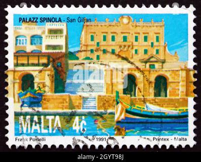 MALTA - CIRCA 1991: a stamp printed in Malta shows Spinola Palace, St. Julian’s, circa 1991 Stock Photo