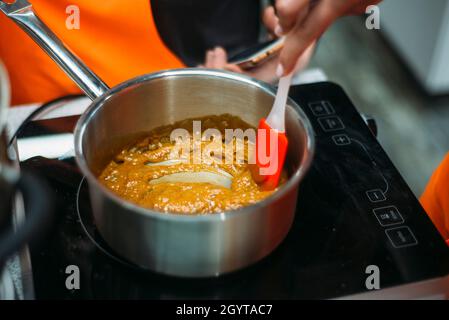 caramel cooking saucepan on the table in the kitchen Stock Photo