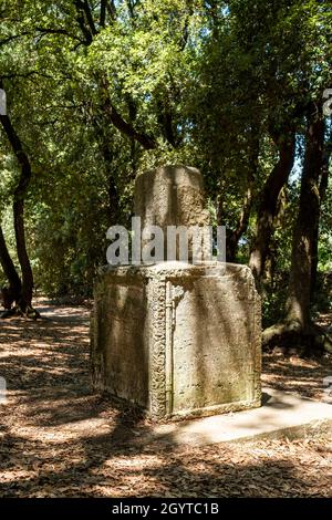 Roman stone cippus, the Sacred Wood of Monteluco, Spoleto, Umbria, Italy Stock Photo
