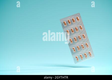 Pills of the drug Molnupiravir in a blister package. Molnupiravir was developed by Merck & Co and is an antiviral Covid-19 therapy. Selective focus