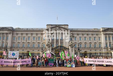 London, UK. 9th October 2021. Protesters, children, and families gathered outside Buckingham Palace and delivered a petition asking the royal family to rewild their land to increase wildlife and help fight the climate crisis.