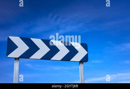 detail of a traffic sign indicating the danger of the curve Stock Photo