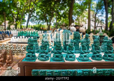 Traditional handcrafted Mexican souvenir statues for sale at marketplace Stock Photo