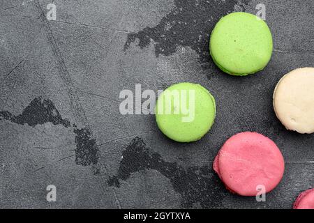 Sweet colorful macarons set, on gray stone table background, top view flat lay, with copy space for text Stock Photo