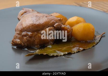 Adobo chicken with potatoes and a bay leaf Stock Photo